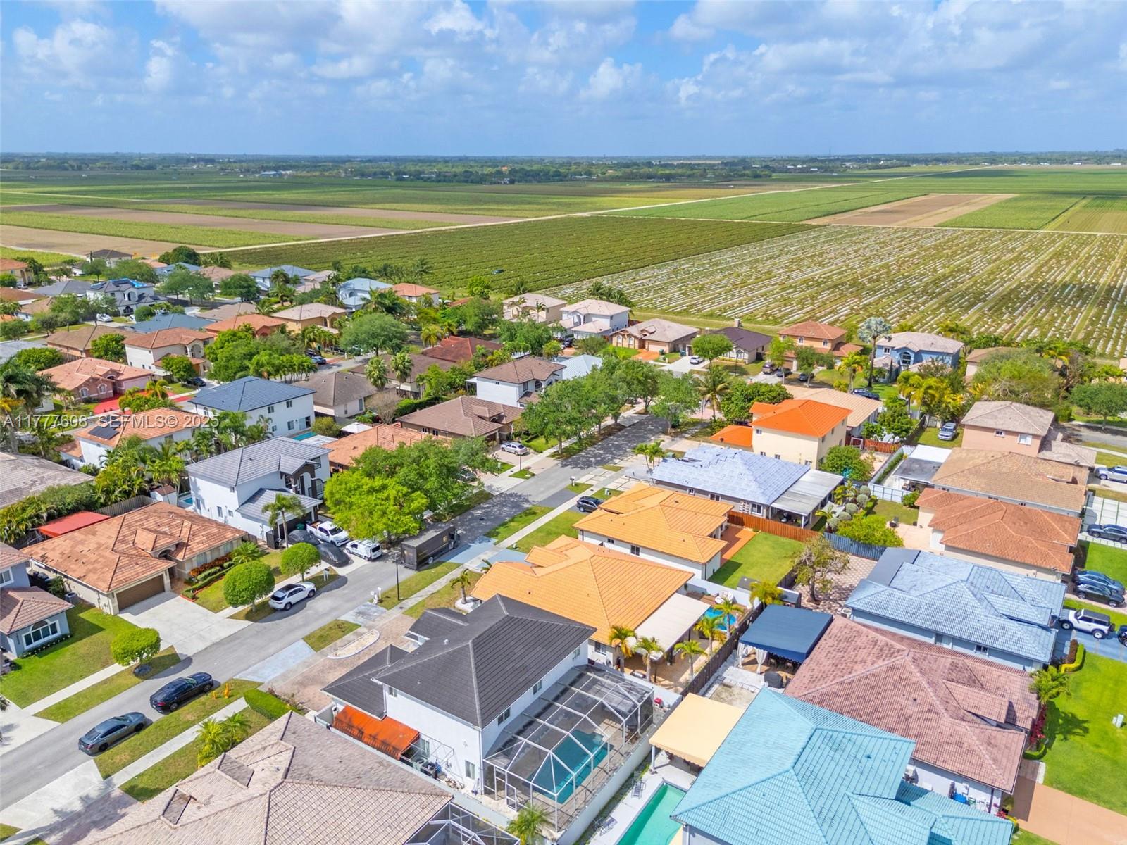 16075 Southwest 149th Terrace Miami, FL 33196 - Photo 44 of 46 a view of a city with an ocean