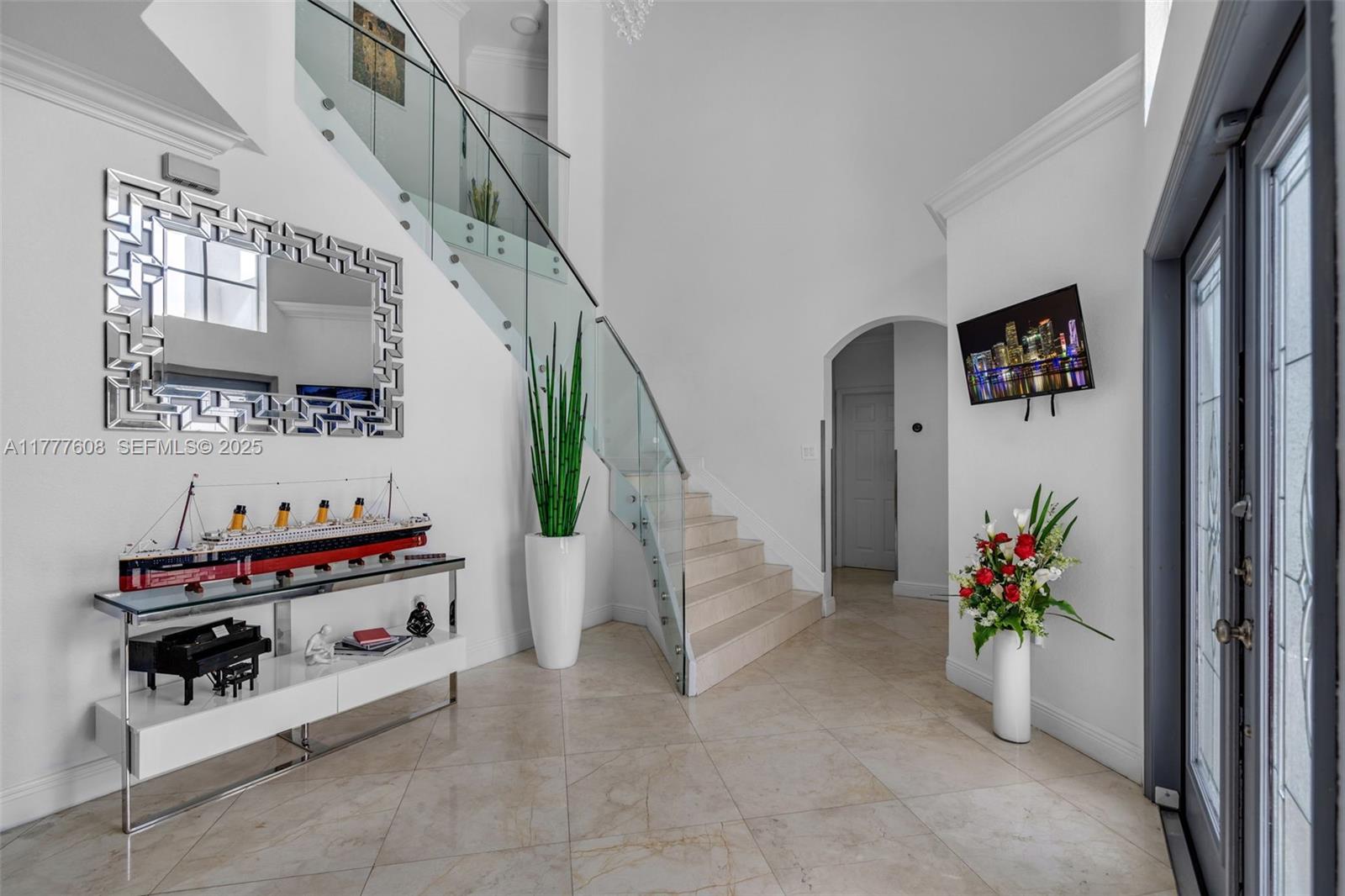 16075 Southwest 149th Terrace Miami, FL 33196 - Photo 5 of 46 a view of entryway with workspace and stairs