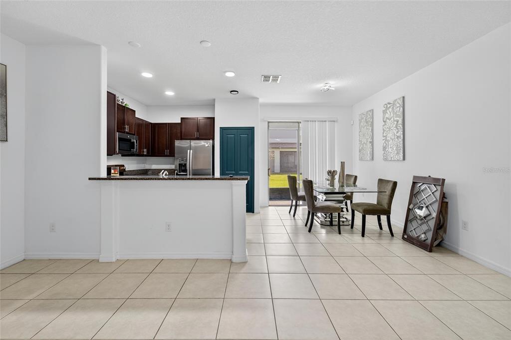 14446 Editors Note Street Ruskin, FL 33573 - Photo 14 of 52 a view of kitchen with microwave and cabinets