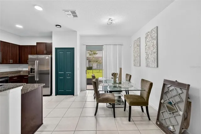 a view of a livingroom with furniture and a flat screen tv