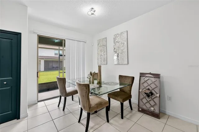 a dining room with furniture and window