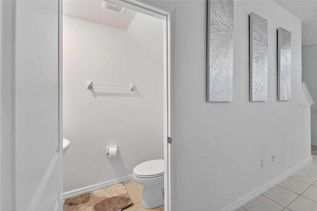 14446 Editors Note Street Ruskin, FL 33573 - Photo 37 of 52 a bathroom with a toilet and a shower