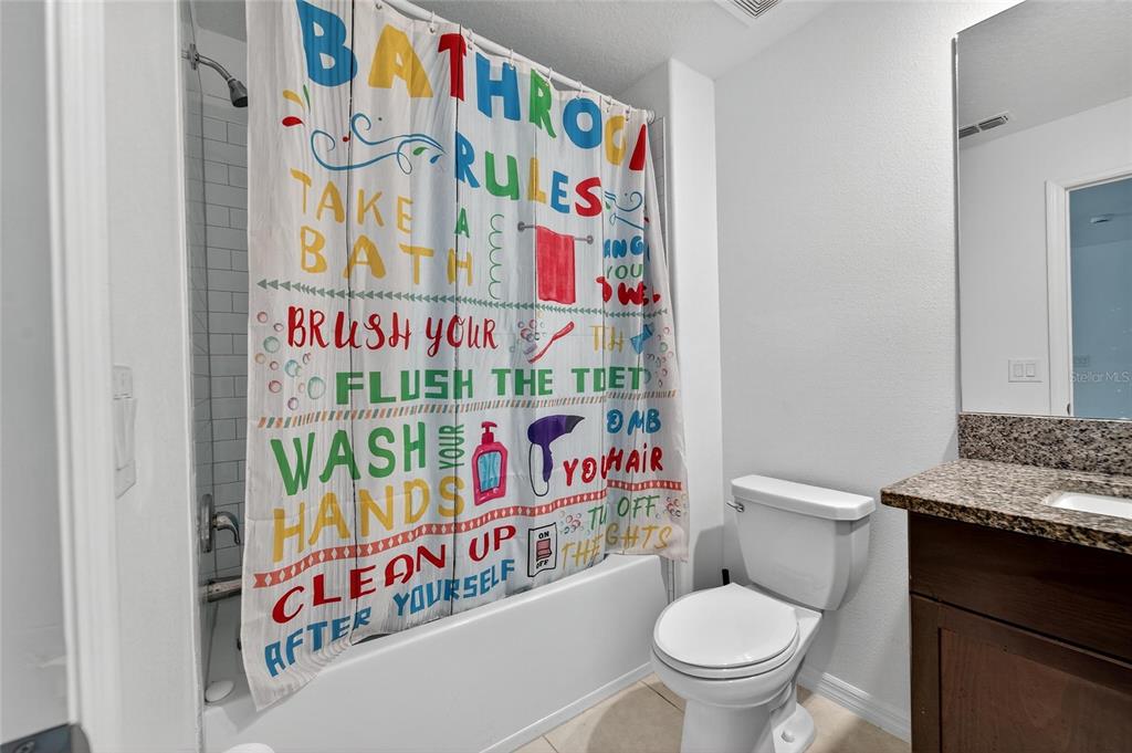 14446 Editors Note Street Ruskin, FL 33573 - Photo 40 of 52 a room that has a lot of flower on the wall