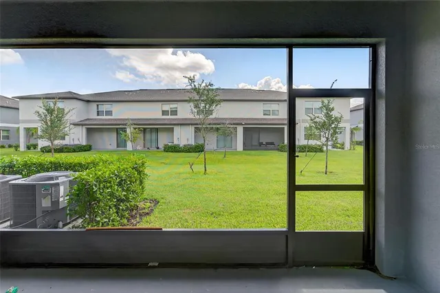 a view of house with yard