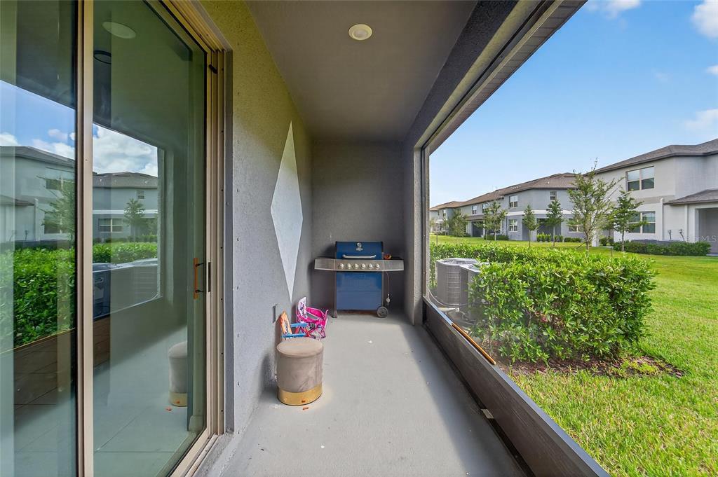 14446 Editors Note Street Ruskin, FL 33573 - Photo 46 of 52 a view of a porch and garden