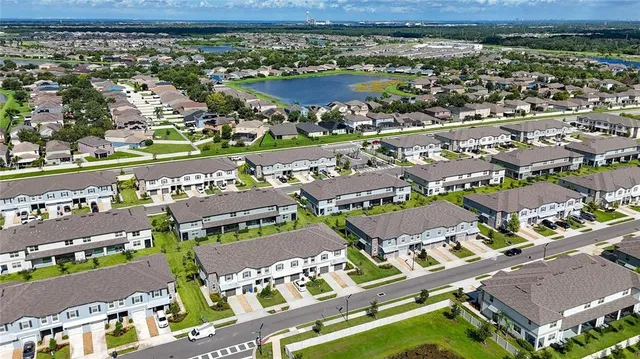 a view of kitchen with microwave and cabinets