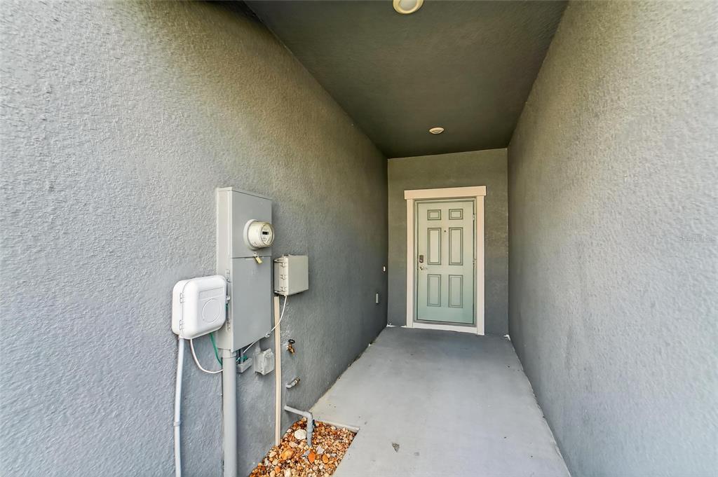 14446 Editors Note Street Ruskin, FL 33573 - Photo 10 of 52 a view of a hallway with front door