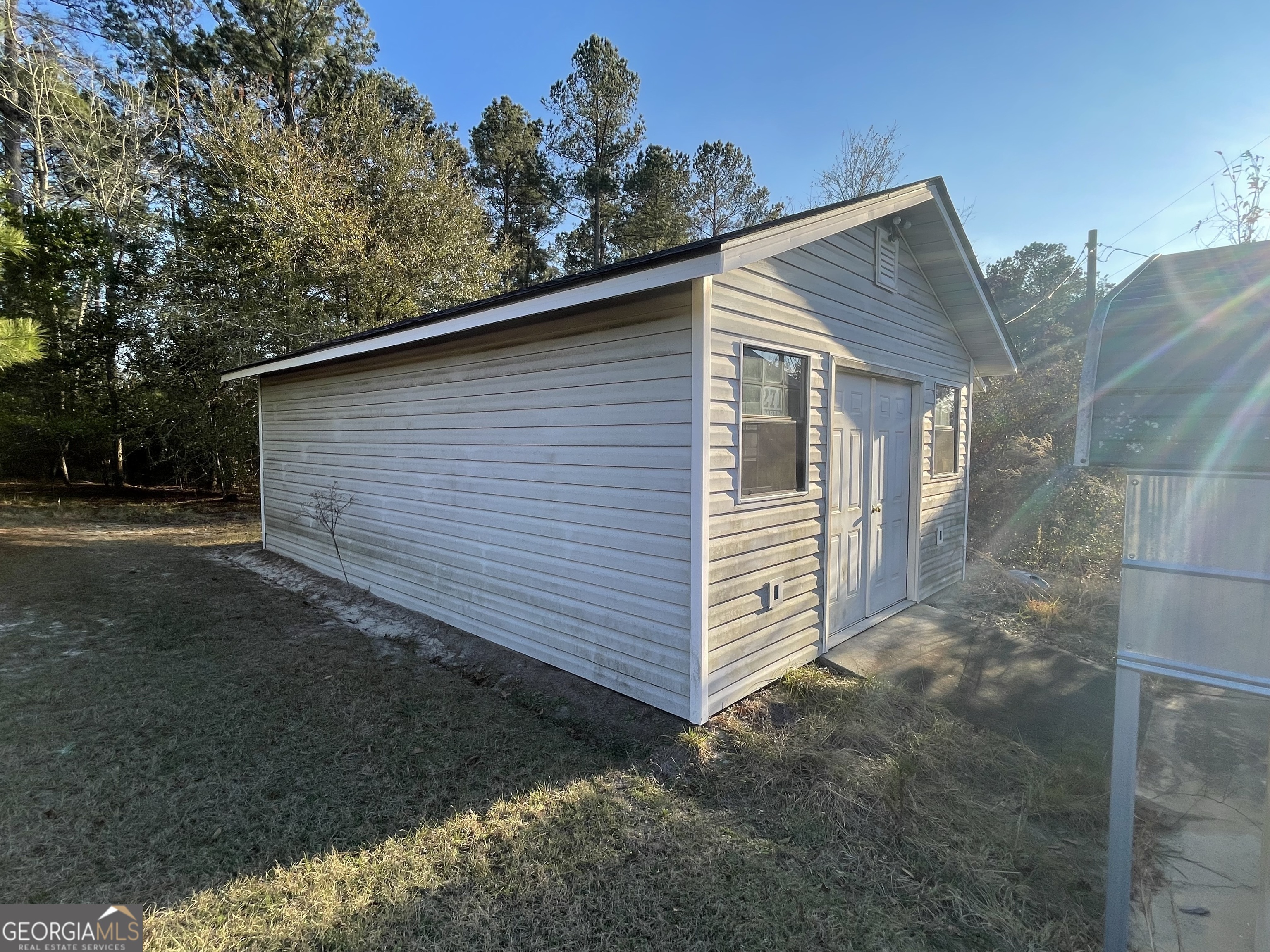 275 Marchants Dairy Road Rhine, GA 31077 - Photo 11 of 42 a backyard of a house with lots of green space