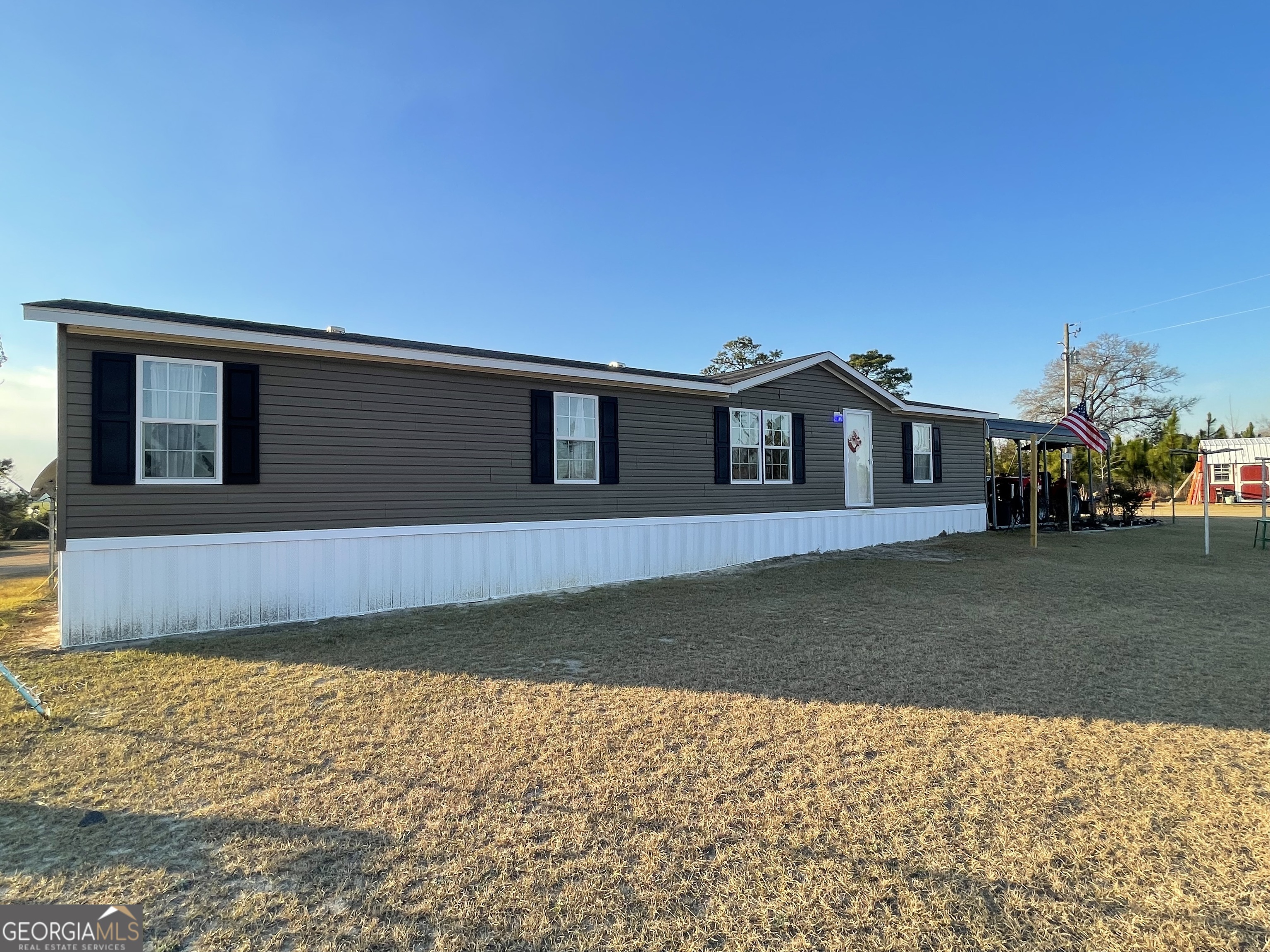 275 Marchants Dairy Road Rhine, GA 31077 - Photo 4 of 42 a front view of a house with a yard