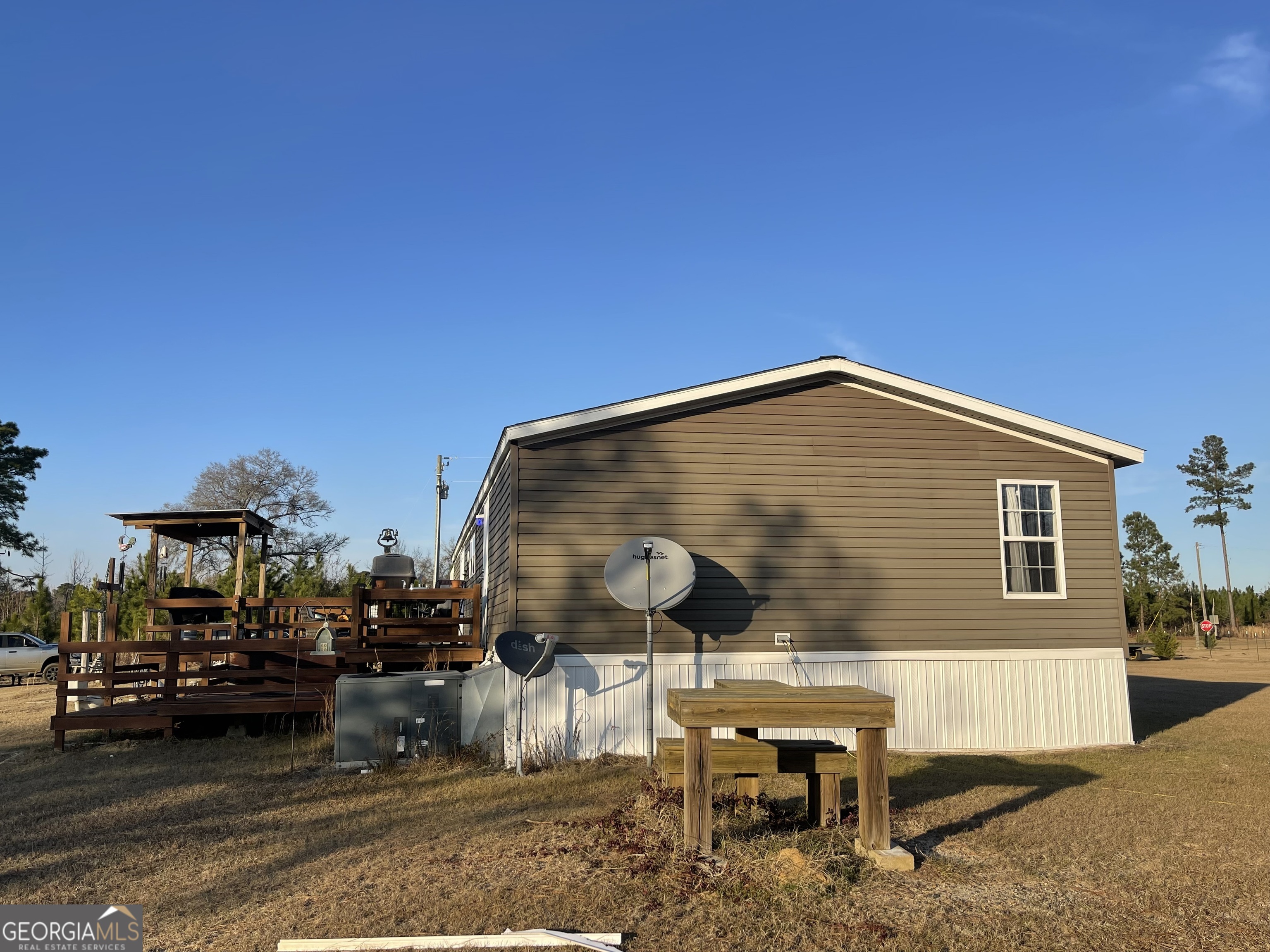 275 Marchants Dairy Road Rhine, GA 31077 - Photo 5 of 42 a balcony with table and chairs
