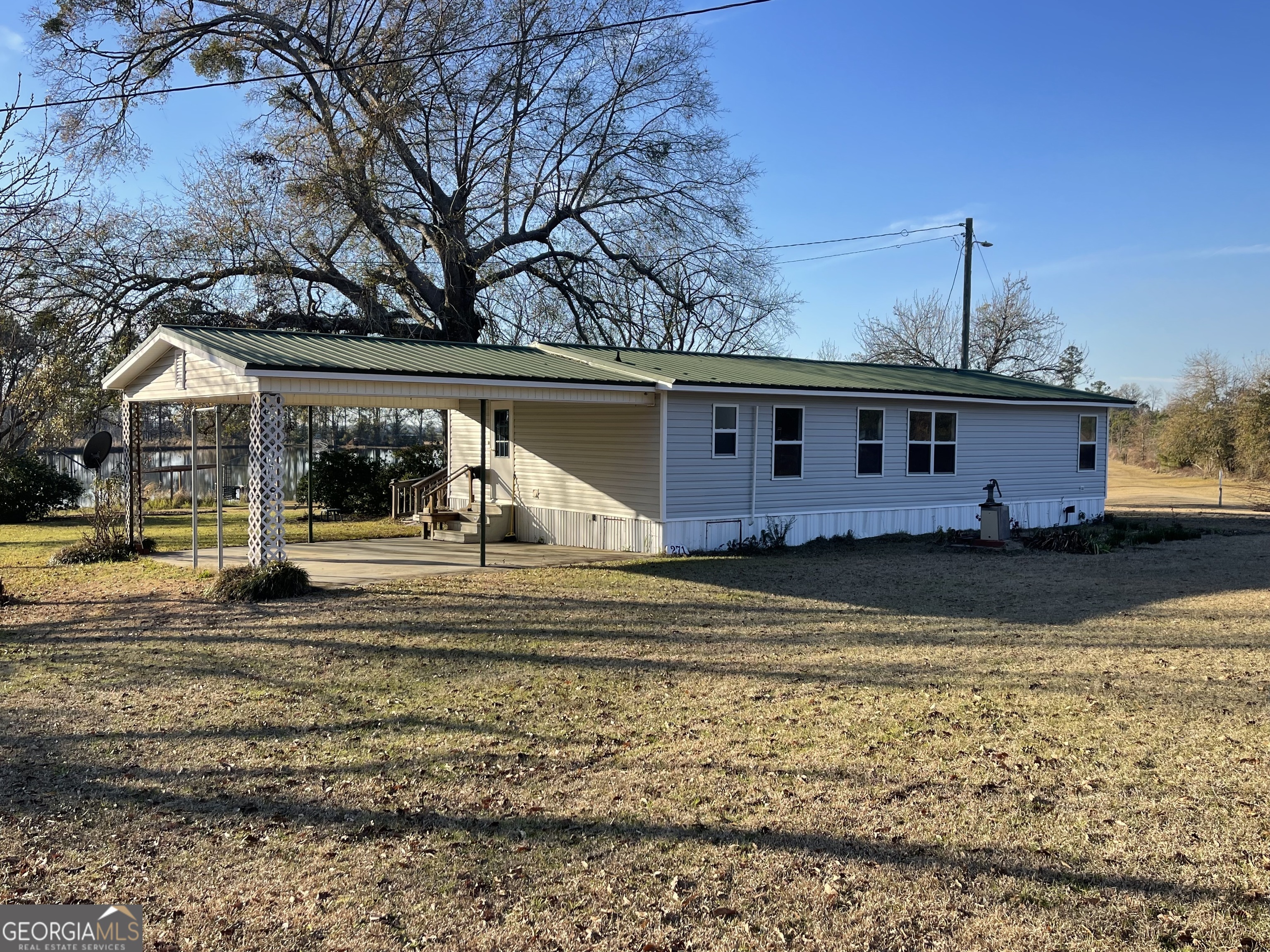 275 Marchants Dairy Road Rhine, GA 31077 - Photo 9 of 42 a view of a house with a yard