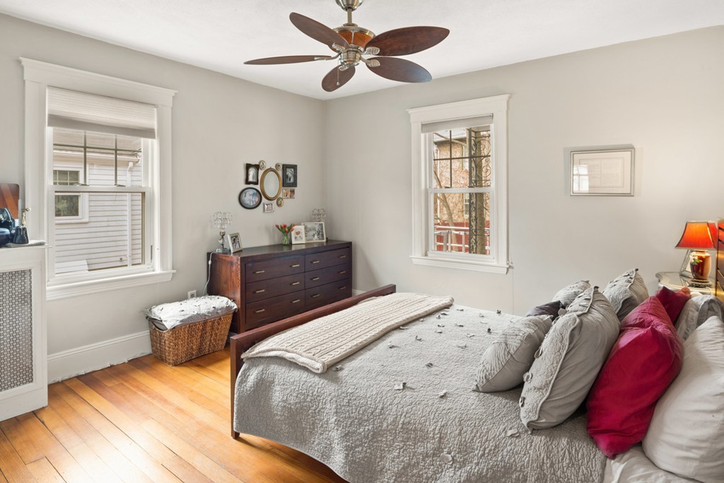 89-91 Elm Road, Unit 1 Newton, MA 02460 - Photo 9 of 18 a bedroom with a bed and a window