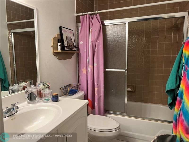 22465 Southwest 61st Way, Unit 241 Boca Raton, FL 33428 - Photo 14 of 18 a bathroom with a sink toilet and shower