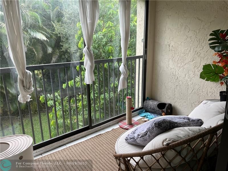 22465 Southwest 61st Way, Unit 241 Boca Raton, FL 33428 - Photo 15 of 18 a bed sitting in a bedroom next to a window