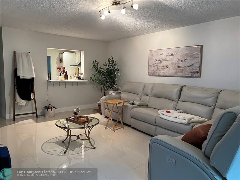 22465 Southwest 61st Way, Unit 241 Boca Raton, FL 33428 - Photo 7 of 18 a living room with furniture