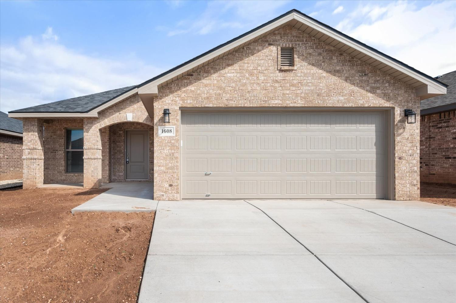 a front view of the house with garage