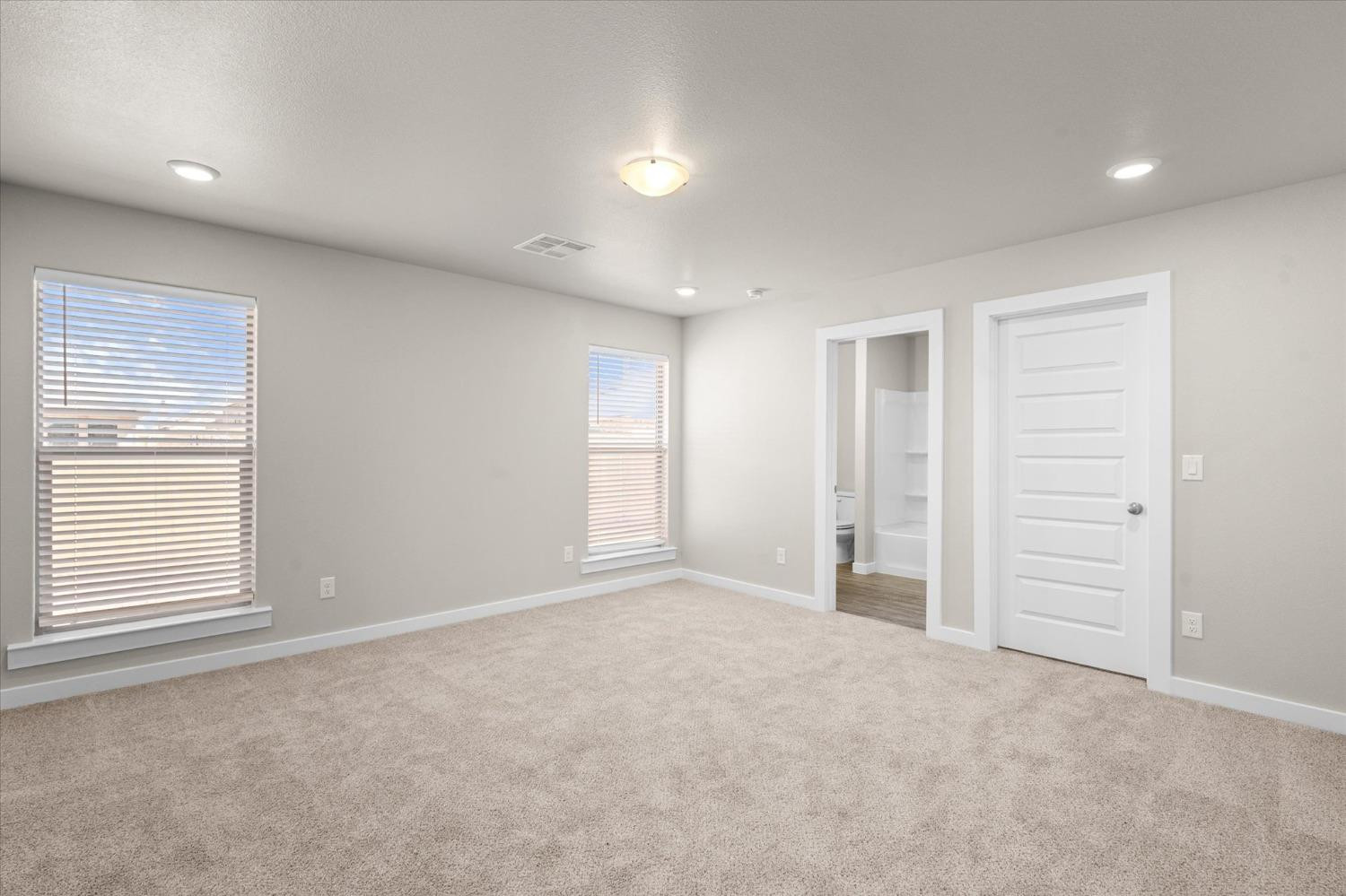 1608 142nd Street Lubbock, TX 79423 - Photo 13 of 20 an empty room with windows and closet