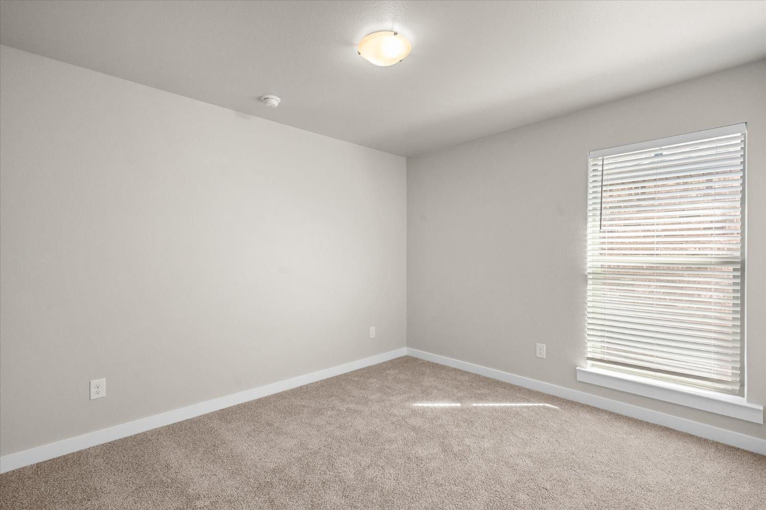 1608 142nd Street Lubbock, TX 79423 - Photo 16 of 20 an empty room with a window
