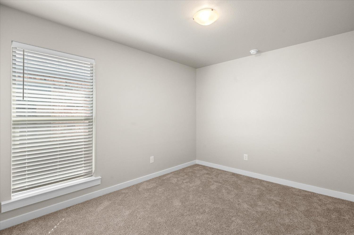 1608 142nd Street Lubbock, TX 79423 - Photo 18 of 20 an empty room with a window