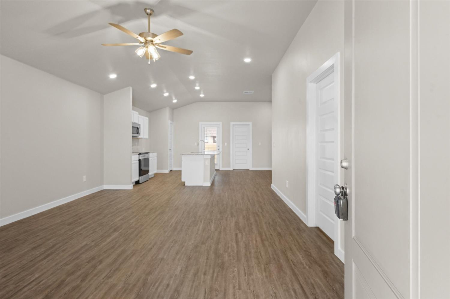 1608 142nd Street Lubbock, TX 79423 - Photo 2 of 20 a view of empty room with wooden floor