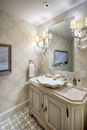 a bathroom with a sink a vanity and a mirror