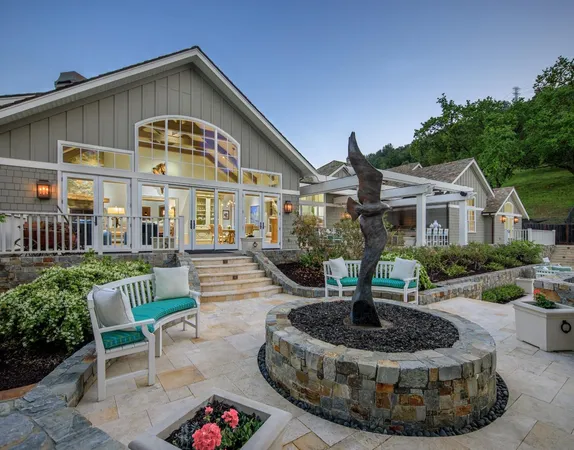 an aerial view of a house with swimming pool