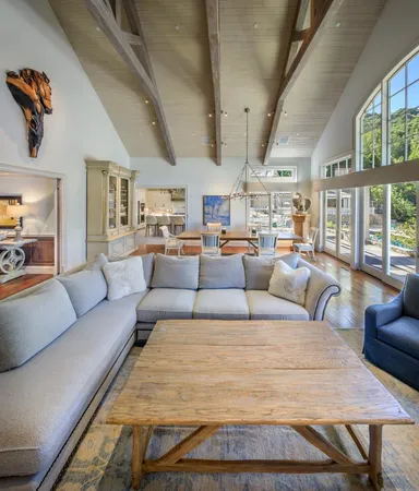 a large bedroom with furniture and windows