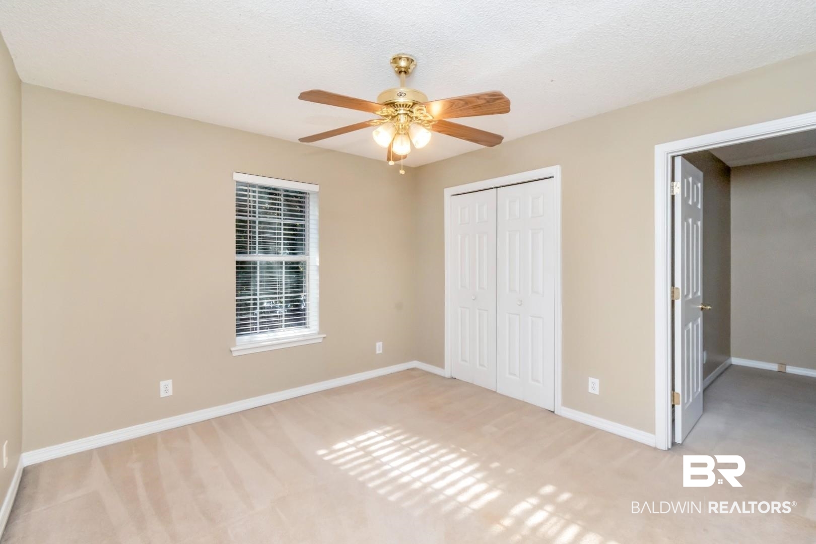 6482 Cedar Bend Court Mobile, AL 36608 - Photo 16 of 26 Unfurnished bedroom with light carpet, a ceiling fan, a closet, and a textured ceiling