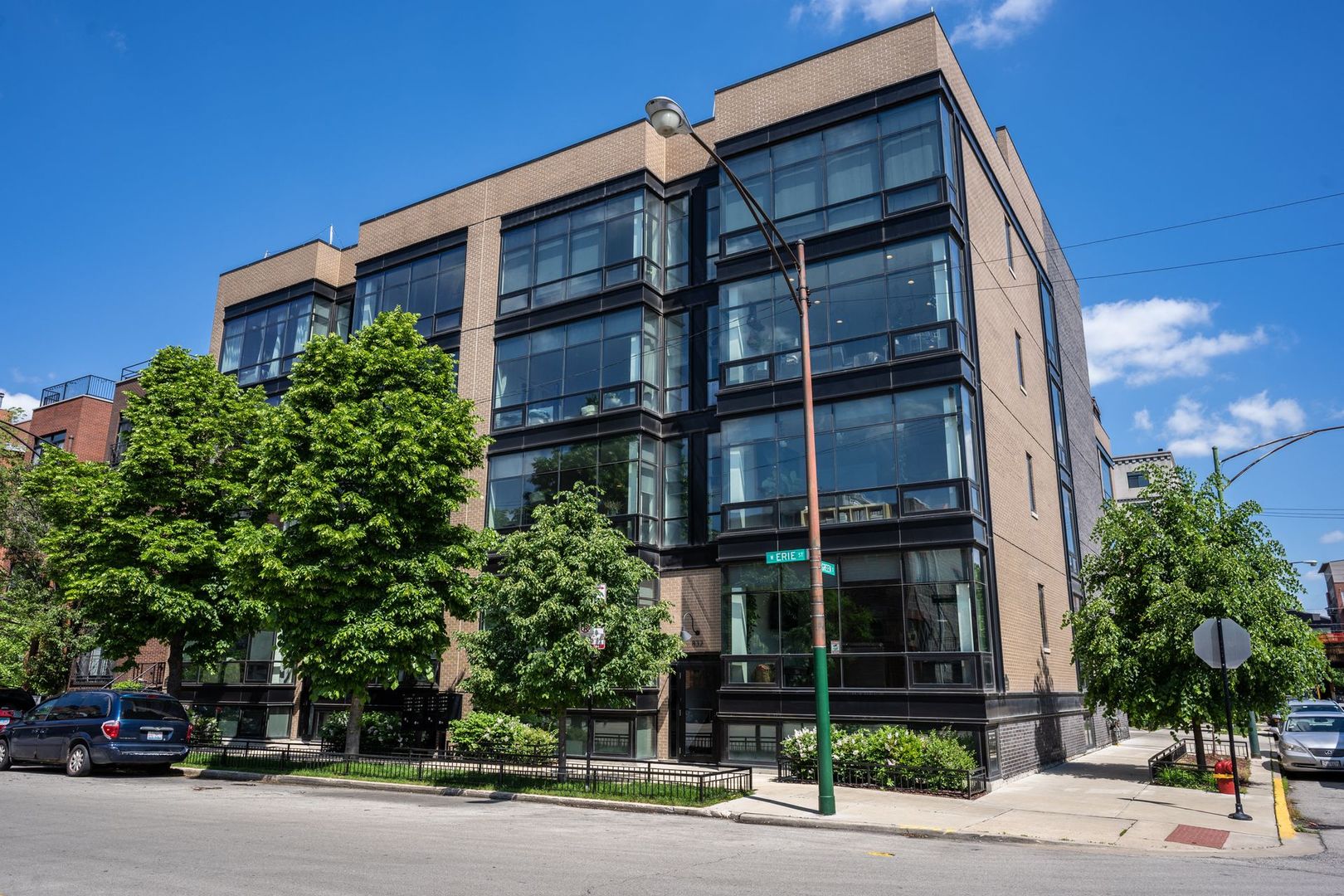 832 West Erie Street, Unit 4W Chicago, IL 60642 - Photo 1 of 8 front view of a building with a street