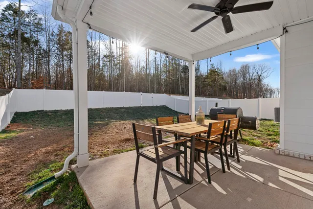 a bathroom with a sink a toilet and shower curtain