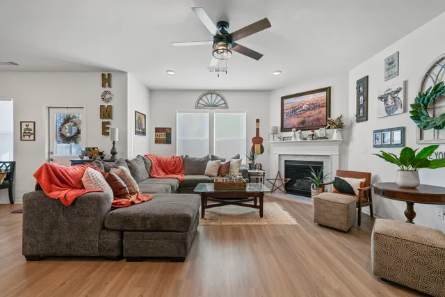 a dining room with furniture and wooden floor