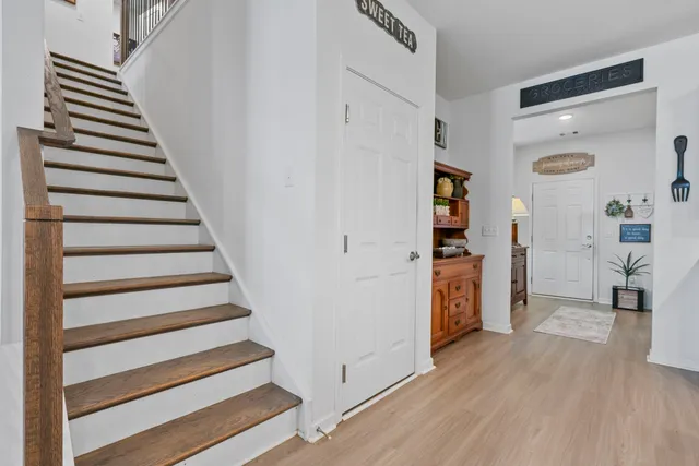 a living room with furniture and a work place area