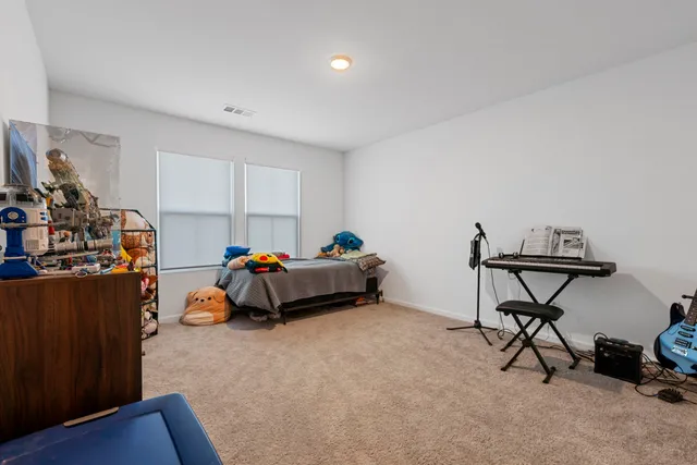 a bedroom with furniture and a fireplace