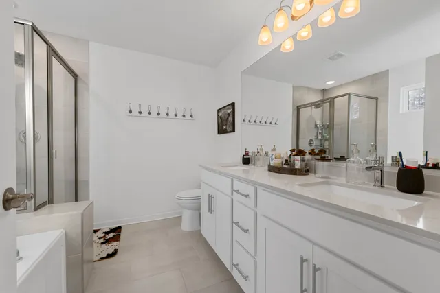 a bathroom with a tub and shower