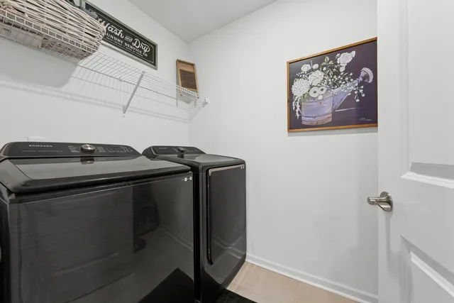 a view of a hallway with wooden floor and entryway