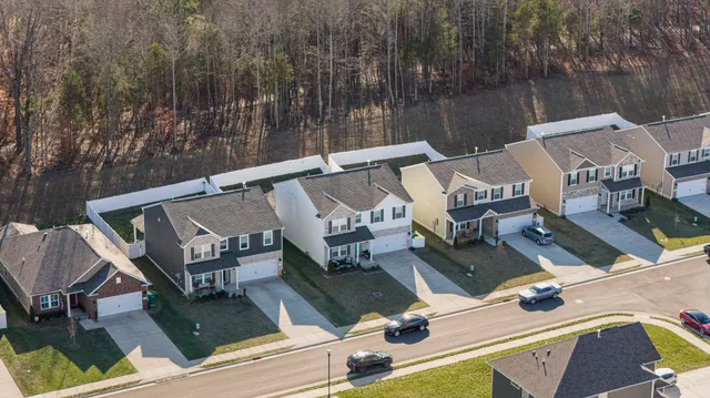 a view of an outdoor dining space with a table and chairs