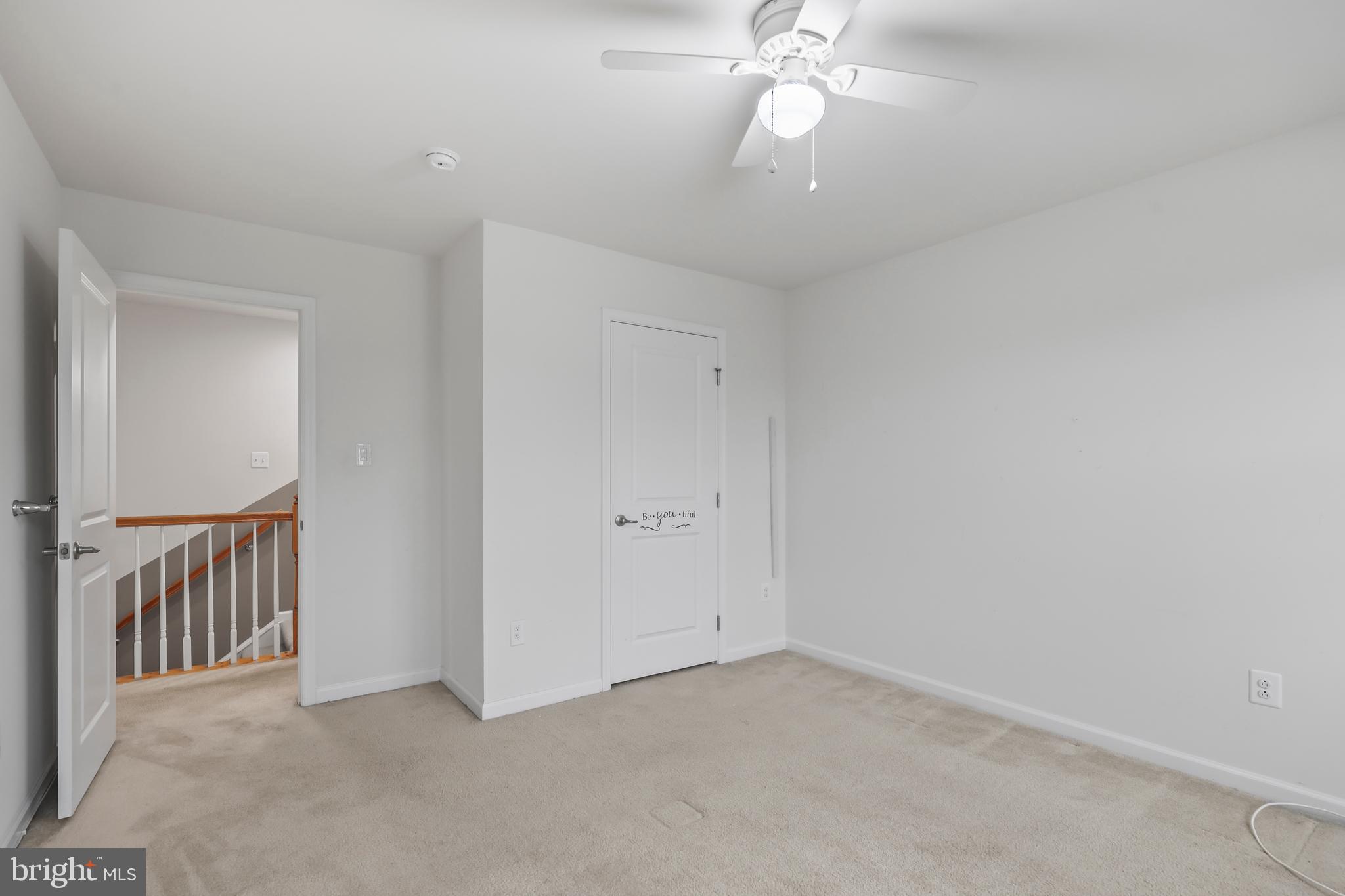 112 Northumberland Drive Stephenson, VA 22656 - Photo 26 of 58 an empty room with a chandelier fan and windows