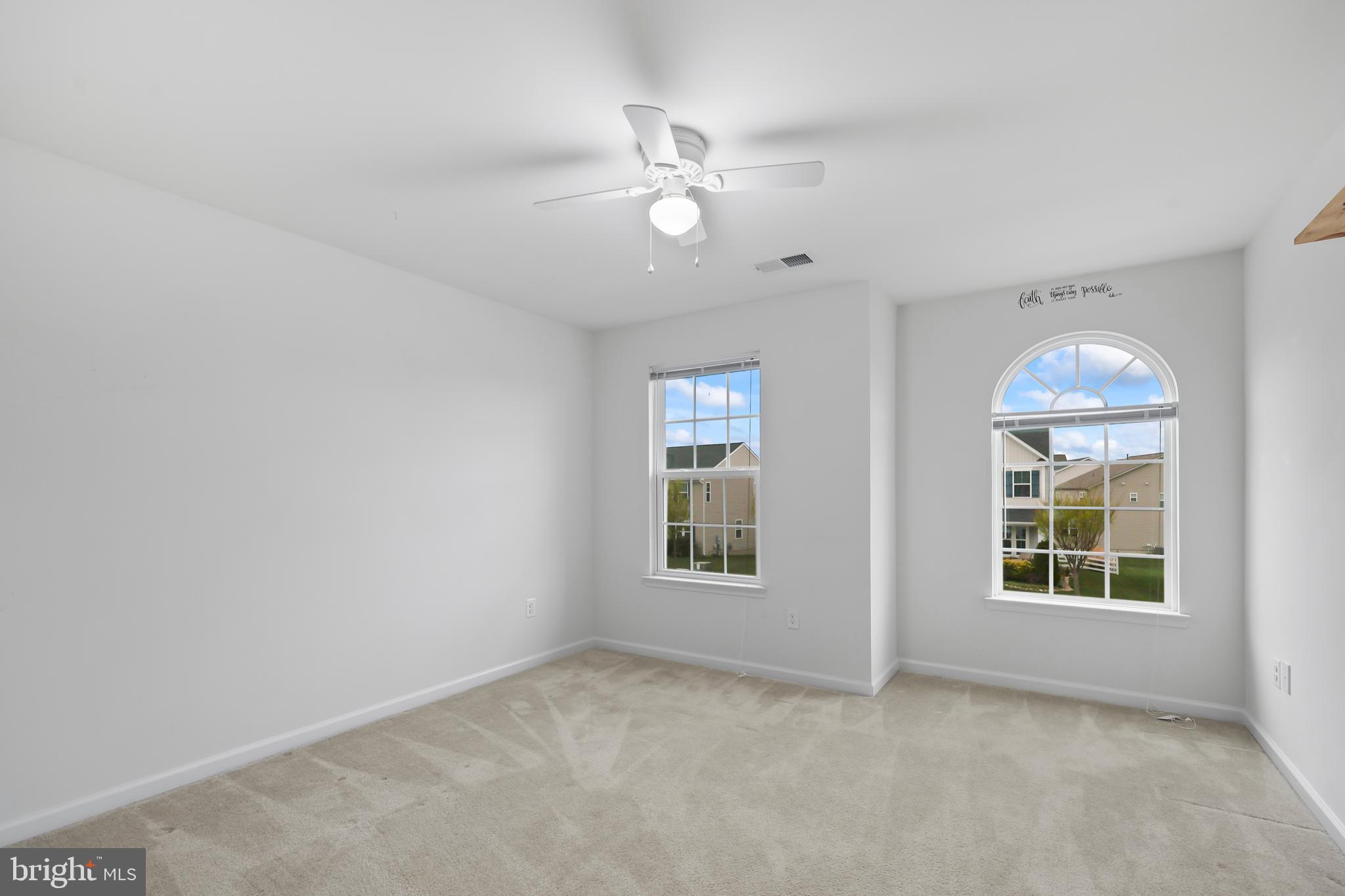 112 Northumberland Drive Stephenson, VA 22656 - Photo 28 of 58 an empty room with windows and ceiling fan