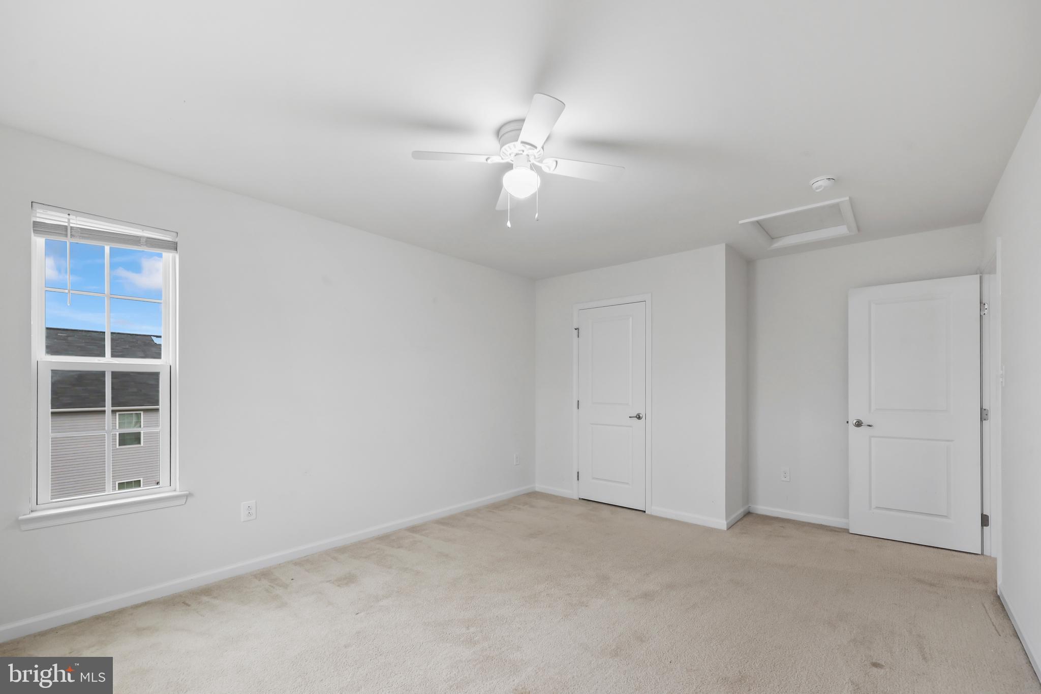 112 Northumberland Drive Stephenson, VA 22656 - Photo 32 of 58 en empty room with windows and ceiling fan