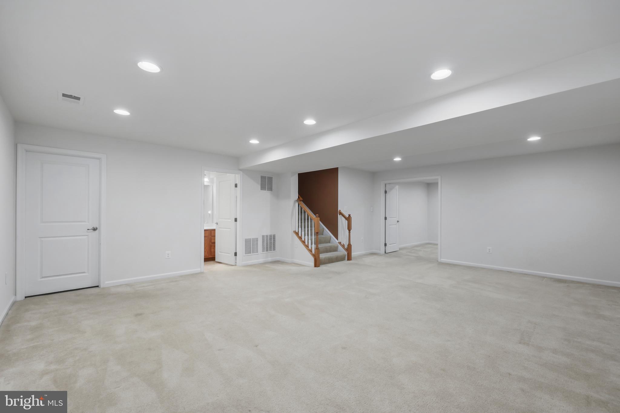 112 Northumberland Drive Stephenson, VA 22656 - Photo 37 of 58 an empty room with windows and stairs