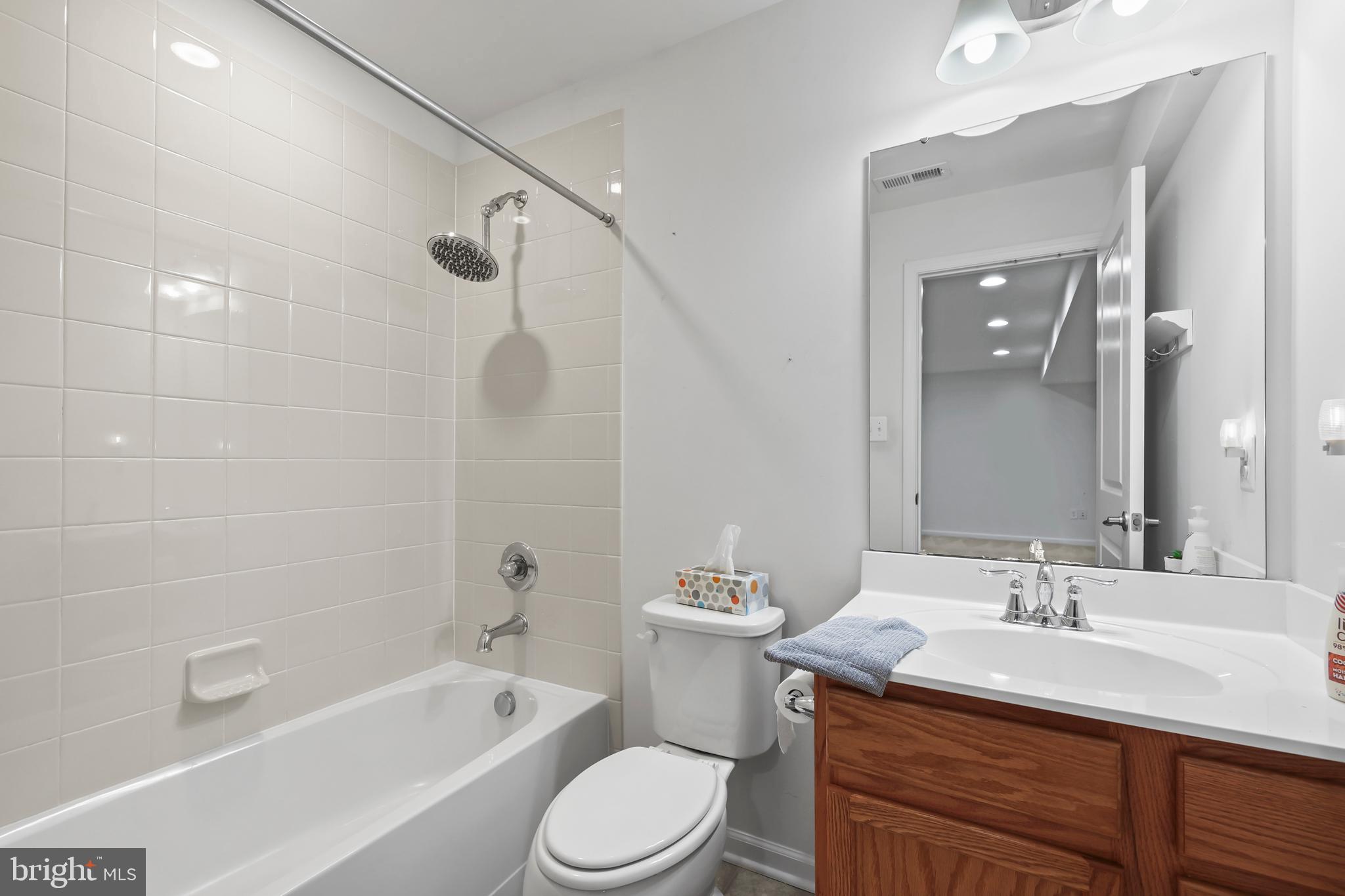 112 Northumberland Drive Stephenson, VA 22656 - Photo 41 of 58 a bathroom with a granite countertop sink a toilet and shower