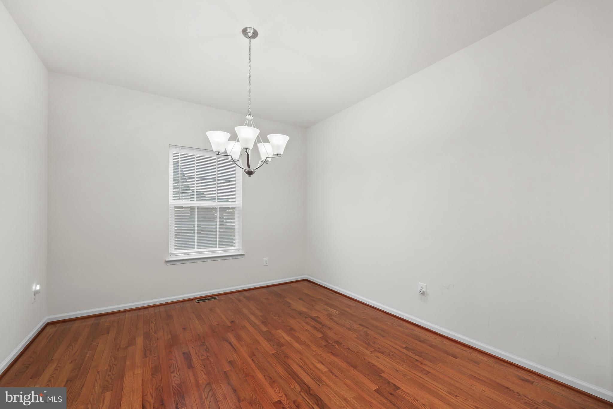 112 Northumberland Drive Stephenson, VA 22656 - Photo 8 of 58 a view of a room with wooden floor and chandelier