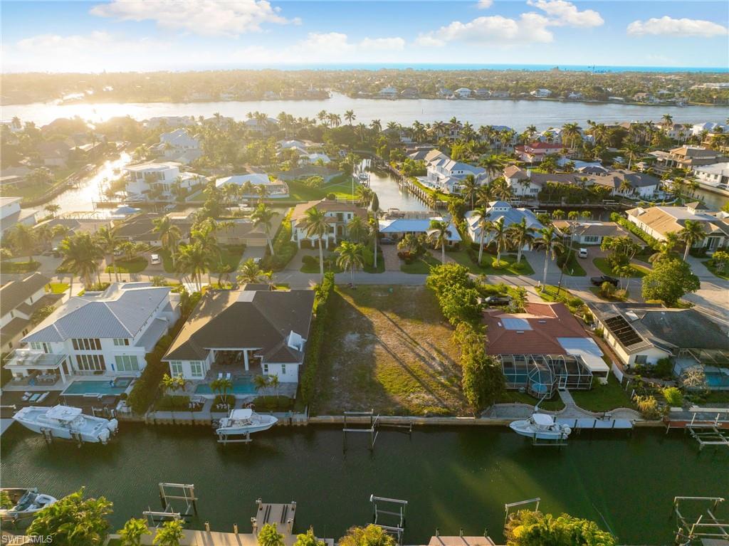 2165 Tarpon Road Naples, FL 34102 - Photo 13 of 14 an aerial view of residential houses with lake view