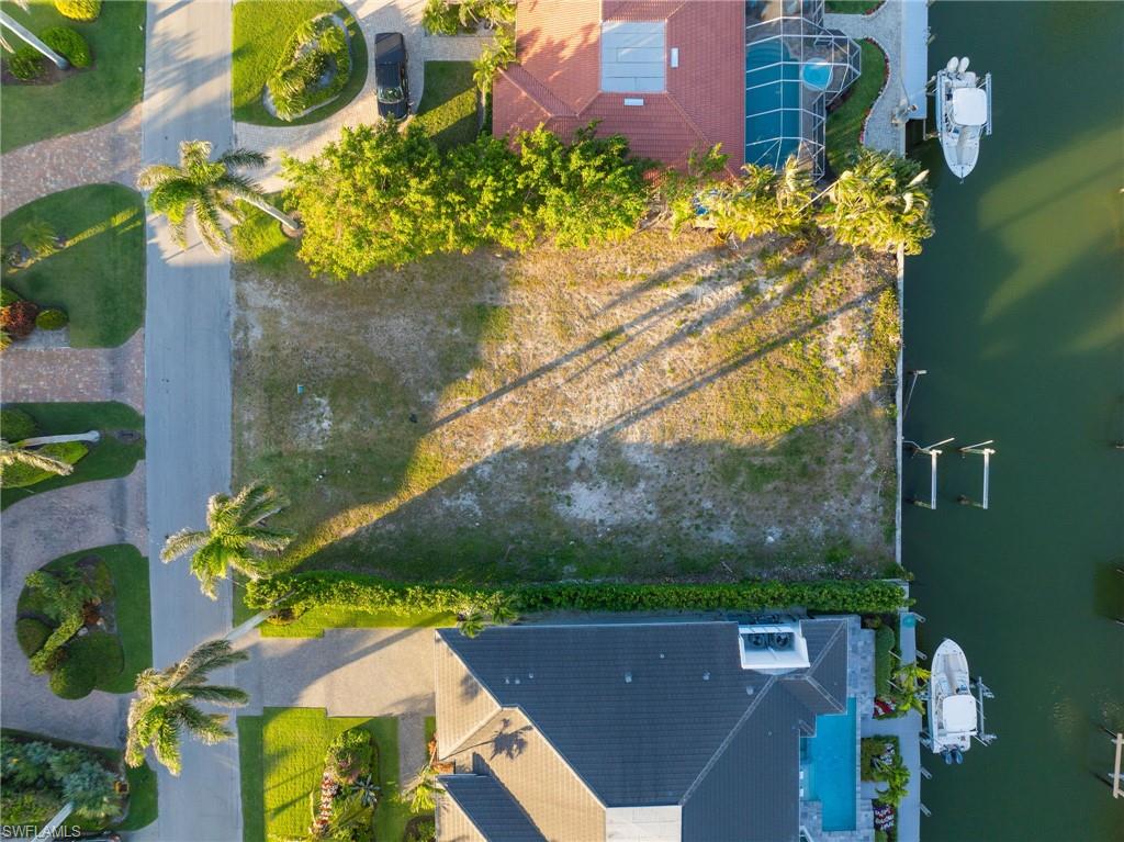 2165 Tarpon Road Naples, FL 34102 - Photo 3 of 14 an aerial view of a house with a yard basket ball court