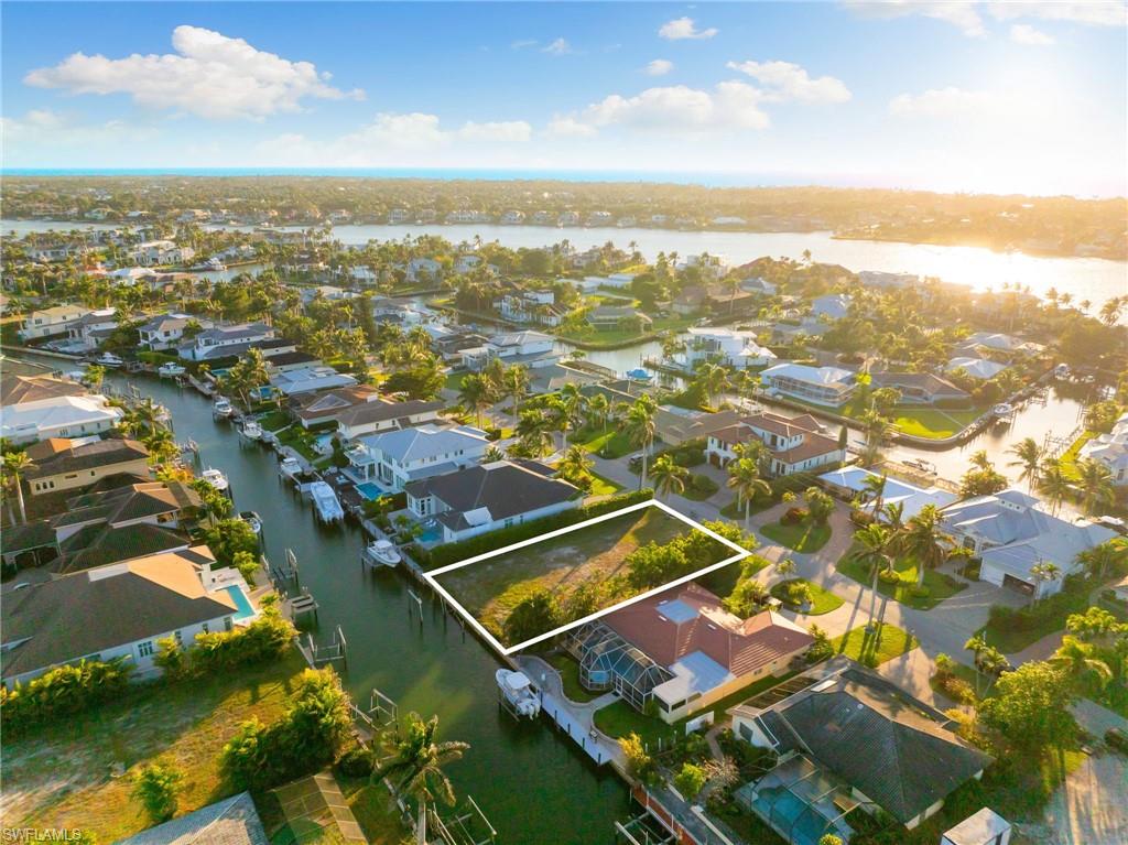 2165 Tarpon Road Naples, FL 34102 - Photo 8 of 14 an aerial view of residential houses with outdoor space
