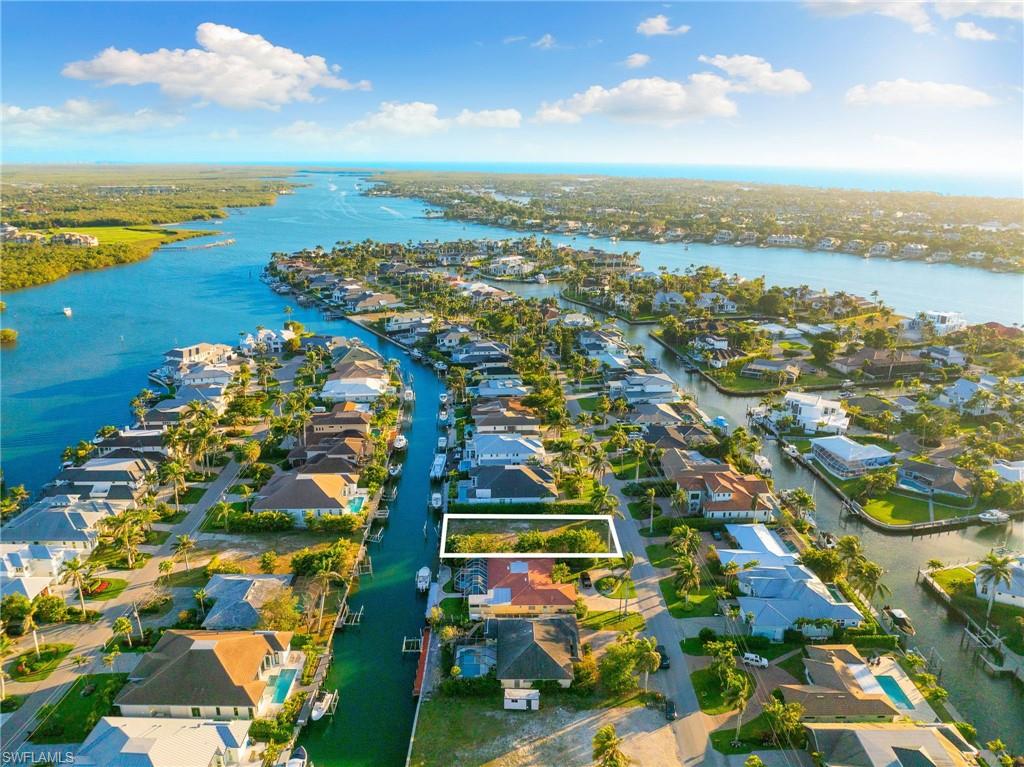 2165 Tarpon Road Naples, FL 34102 - Photo 10 of 14 an aerial view of residential building and lake