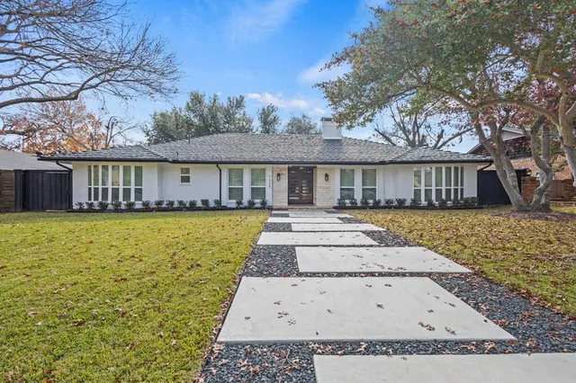 a view of a house with a swimming pool