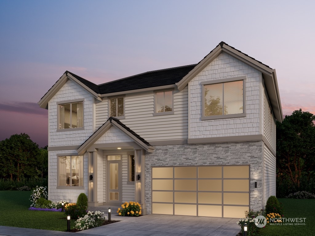 933 131st Place Northeast, Unit 4 Bellevue, WA 98005 - Photo 1 of 18 a front view of a house with a yard