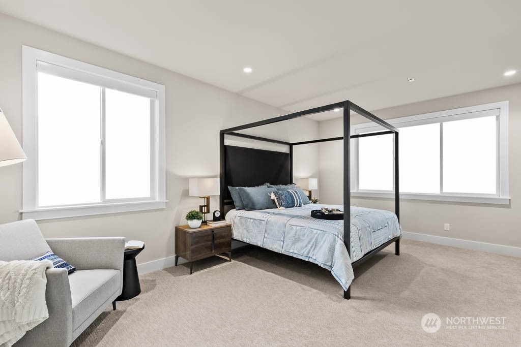 933 131st Place Northeast, Unit 4 Bellevue, WA 98005 - Photo 12 of 18 a bedroom with a bed and window