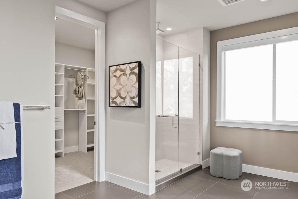 933 131st Place Northeast, Unit 4 Bellevue, WA 98005 - Photo 15 of 18 a view of a hallway with bathroom and a shower